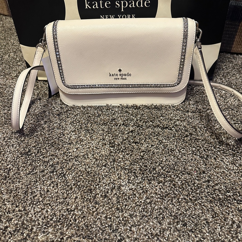NWT.  Kate Spade Off White Crossbody Bag with Flap Closure and Adjustable Strap